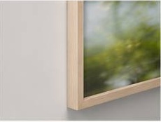 Close-up of framed abstract nature photograph on a wall