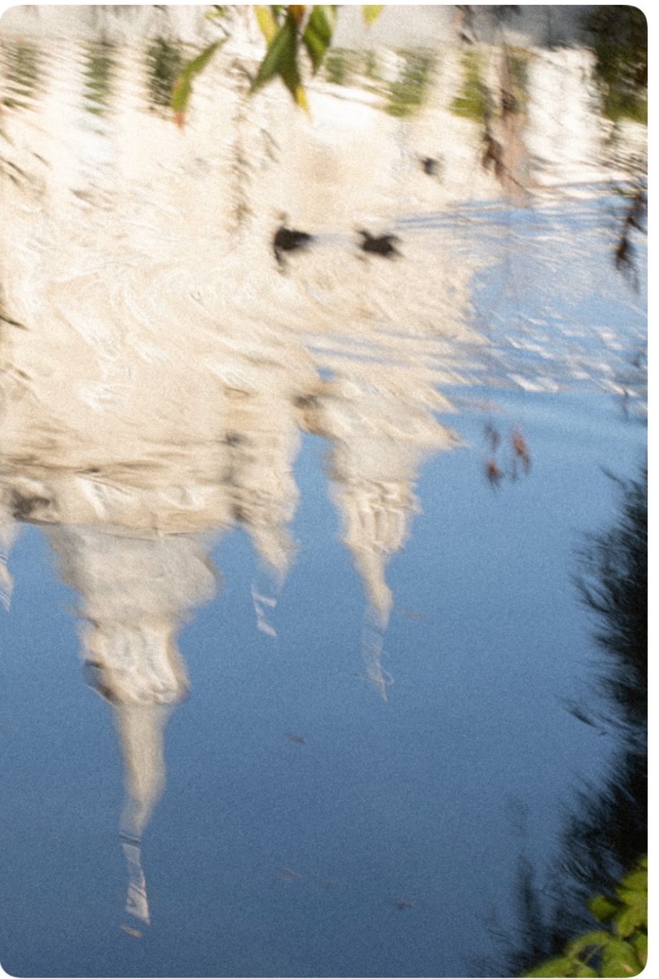 Clouds reflected in water